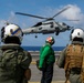 Abraham Lincoln's commanding officer pilots an MH-60R Sea Hawk