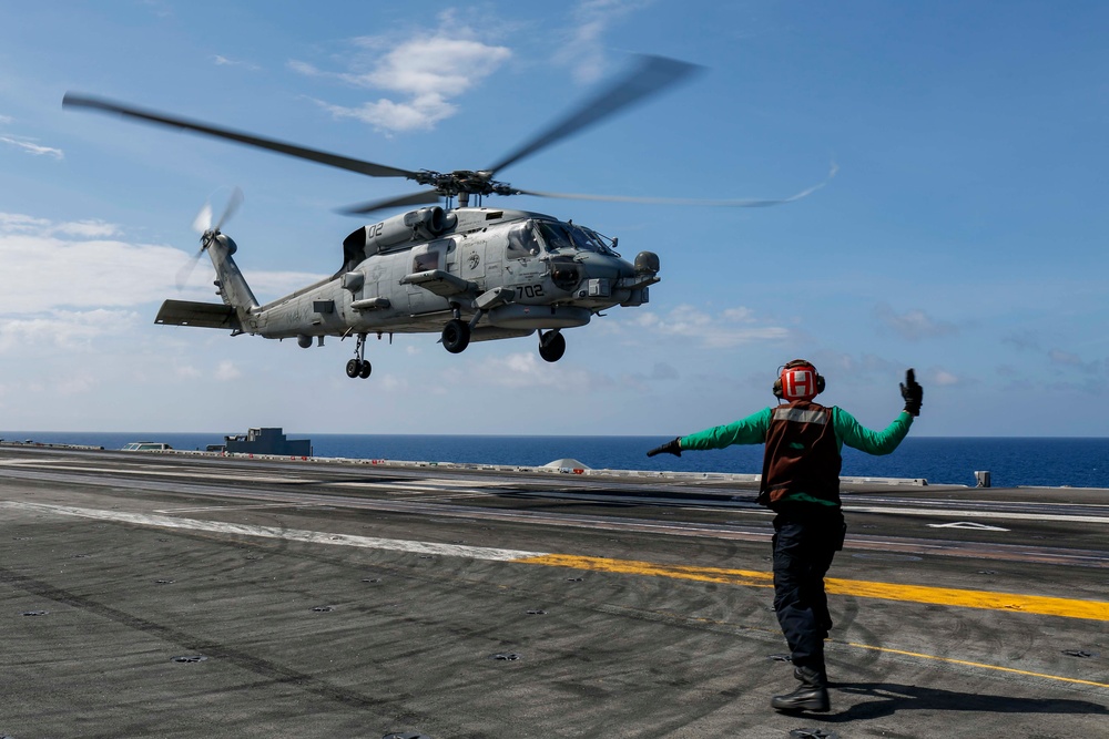 Abraham Lincoln's commanding officer pilots an MH-60R Sea Hawk