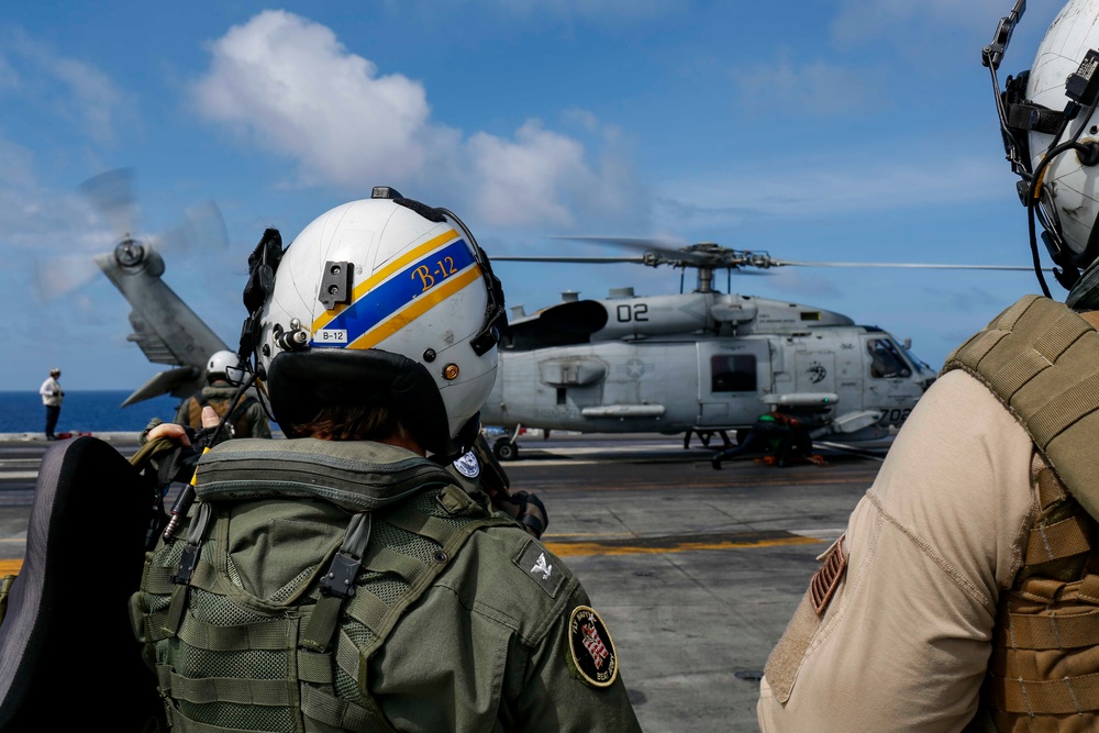 Abraham Lincoln's commanding officer pilots an MH-60R Sea Hawk