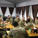 Command Sgt. Maj. Harris talks with junior enlisted Soldiers