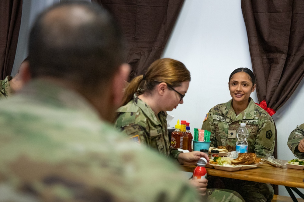 Command Sgt. Maj. Harris talks with junior enlisted Soldiers