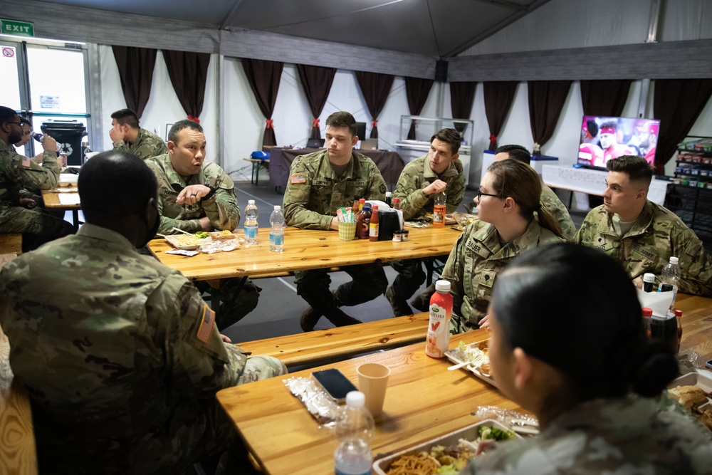 Command Sgt. Maj. Harris talks with junior enlisted Soldiers