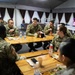 Command Sgt. Maj. Harris talks with junior enlisted Soldiers