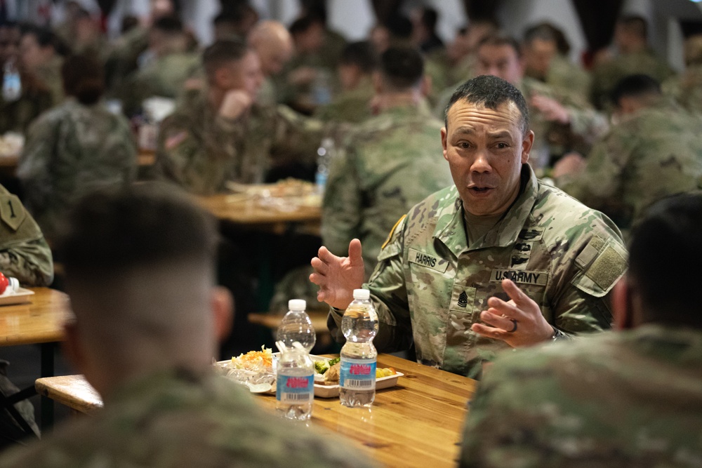 Command Sgt. Maj. Harris talks with junior enlisted Soldiers