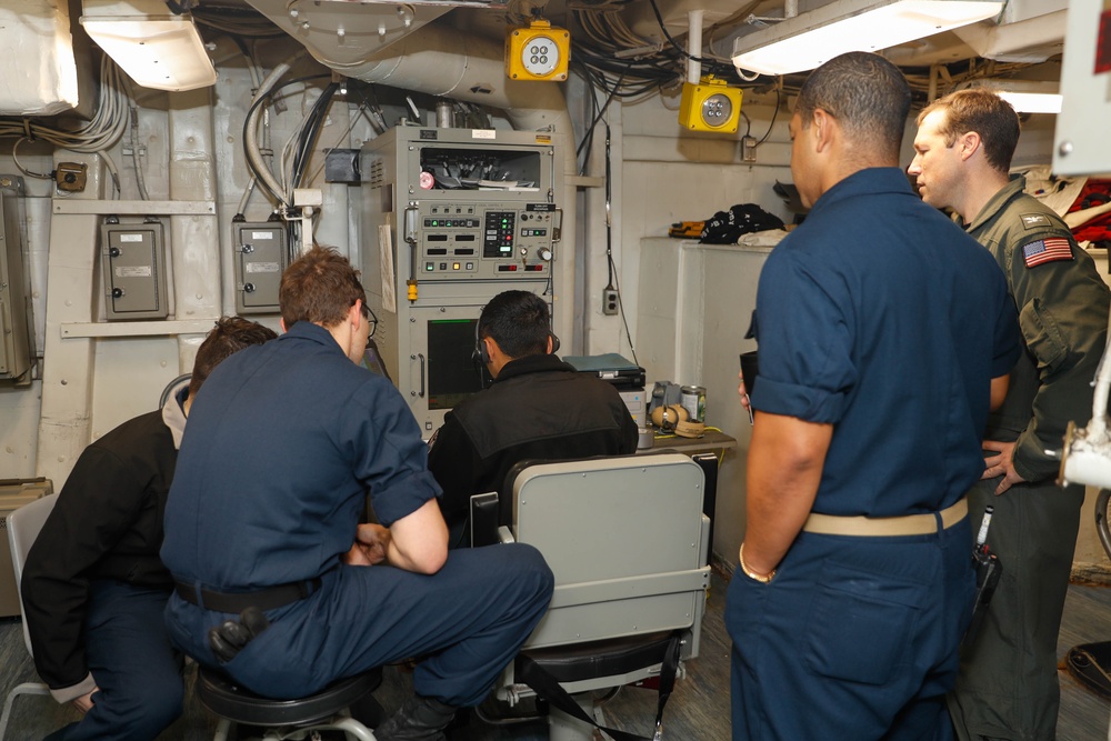 Abraham Lincoln Sailors operate a CIWS