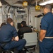 Abraham Lincoln Sailors operate a CIWS