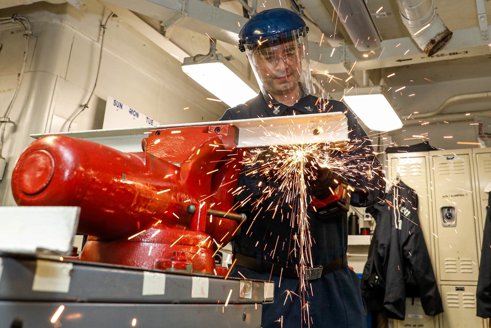 Abraham Lincoln Sailors conduct aircraft maintenance