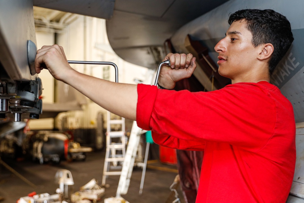 Abraham Lincoln Sailors conduct aircraft maintenance