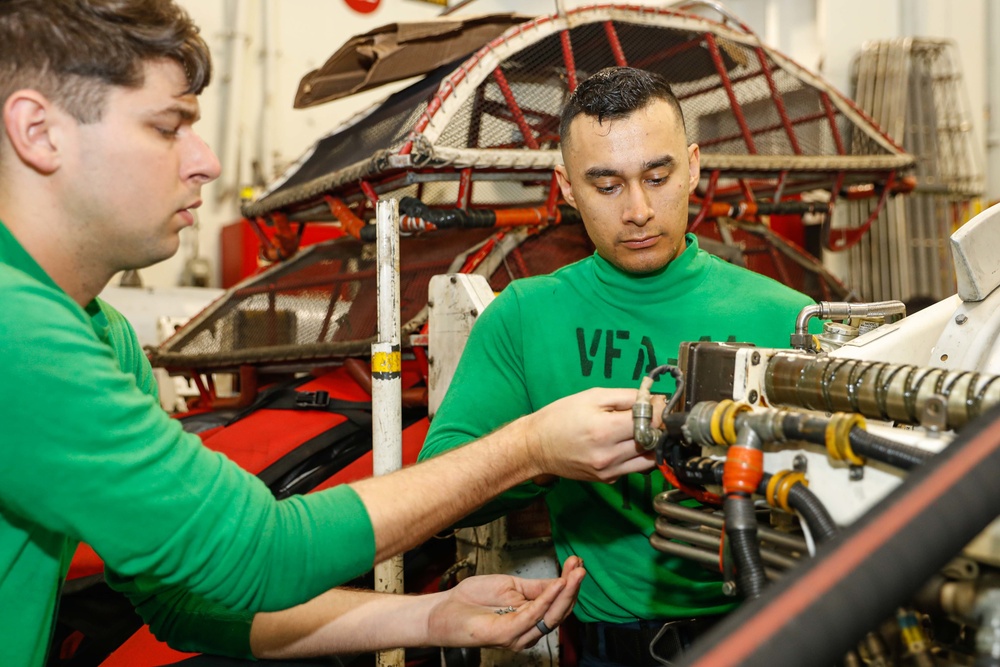 Abraham Lincoln Sailors conduct aircraft maintenance