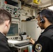 Abraham Lincoln Sailors operate a CIWS