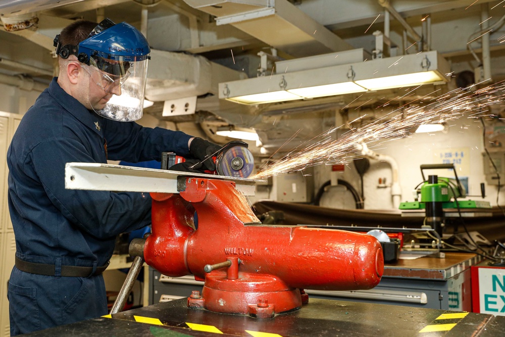 Abraham Lincoln Sailors conduct aircraft maintenance