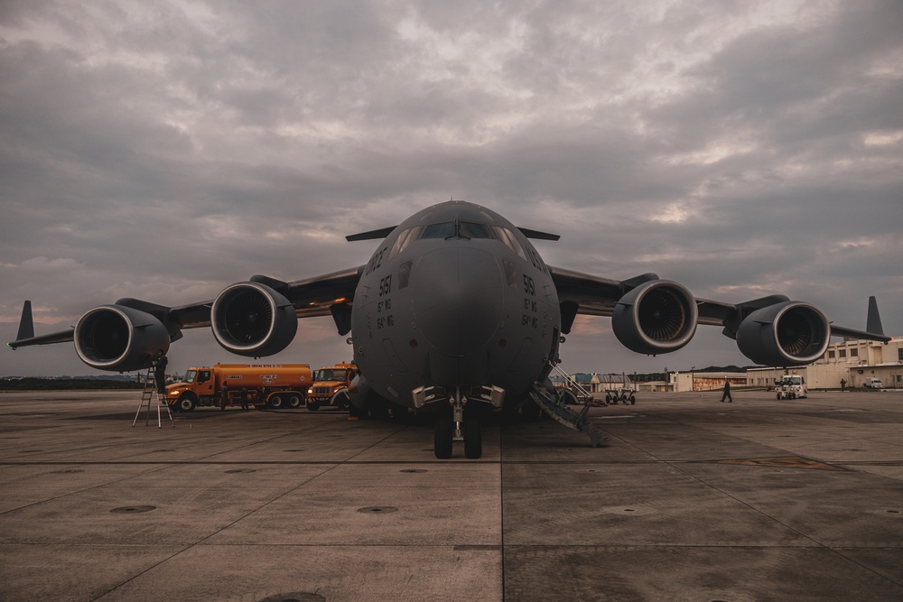 U.S. Air Force C-17 lands on MCAS Futenma to deliver two AH-1Z Viper attack helicopters