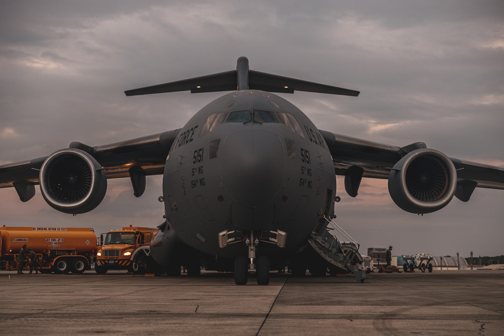 U.S. Air Force C-17 lands on MCAS Futenma to deliver two AH-1Z Viper attack helicopters