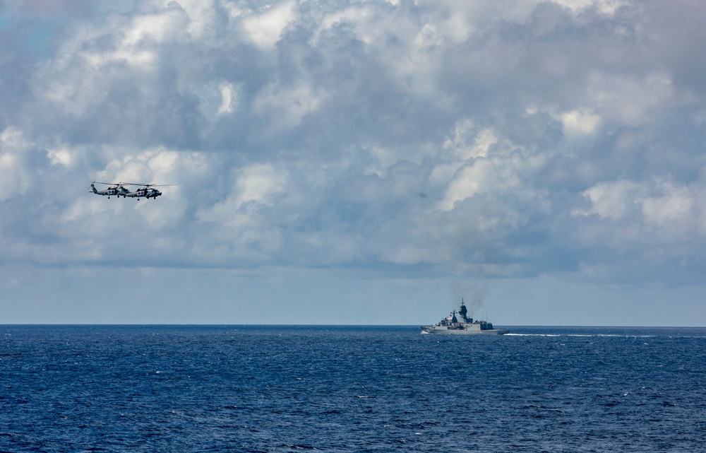 Squadrons Aboard USS Ralph Johnson (DDG 114) and HMAS Arunta (FFH 151) of the Royal Australian Navy Conduct Joint Flight Operations