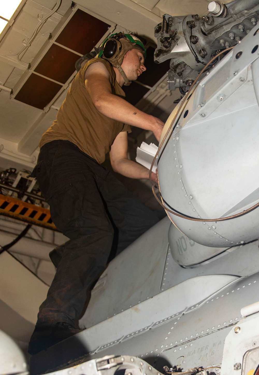 Sailors Conduct Maintenance on Aircraft Aboard USS Ralph Johnson (DDG 114)