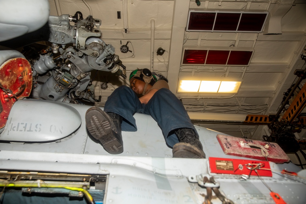 Sailors Maintenance on Aircraft Aboard USS Ralph Johnson (DDG 114)