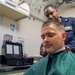 USS Charleston Sailor Receives Haircut