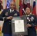 Col. Carr presents certificate