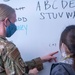 Afghan children participate in community-based education