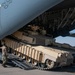 816th Expeditionary Airlift Squadron flies an M1A2 SEPV2 Abrams Tank over Ali Al Salem Air Base