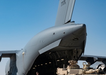 816th Expeditionary Airlift Squadron flies an M1A2 SEPV2 Abrams Tank over Ali Al Salem Air Base