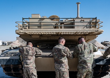 816th Expeditionary Airlift Squadron flies an M1A2 SEPV2 Abrams Tank over Ali Al Salem Air Base
