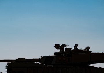 816th Expeditionary Airlift Squadron flies an M1A2 SEPV2 Abrams Tank over Ali Al Salem Air Base