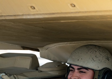 816th Expeditionary Airlift Squadron flies an M1A2 SEPV2 Abrams Tank over Ali Al Salem Air Base
