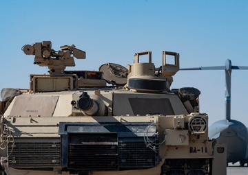 816th Expeditionary Airlift Squadron flies an M1A2 SEPV2 Abrams Tank over Ali Al Salem Air Base