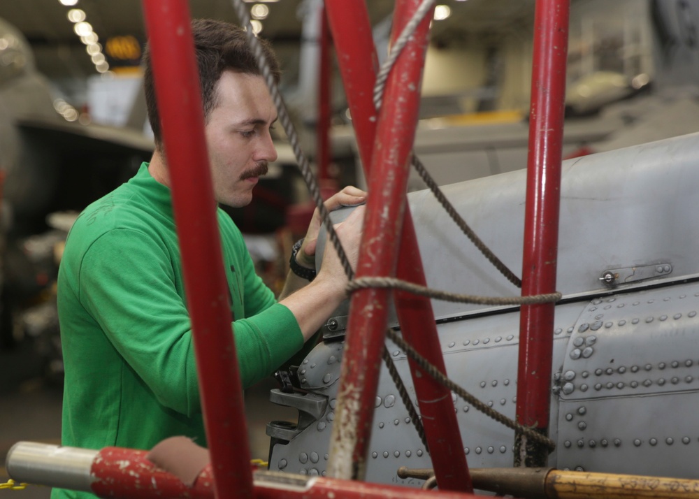 Abraham Lincoln Sailors conduct aircraft maintenance