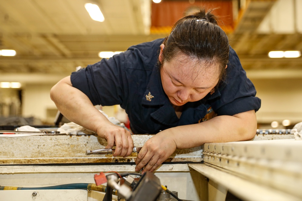 Abraham Lincoln Sailors conduct aircraft maintenance