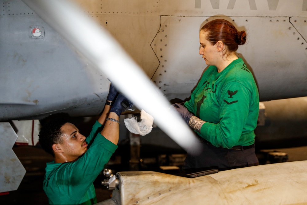 Abraham Lincoln Sailors conduct aircraft maintenance