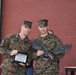 SgtMaj Earl Budd, AAS Sergeant Major, and Maj Daniel Petronzio, AAS Executive Officer for Assault Amphibian School, accept a plaque from the volunteers and their families from RNDC.