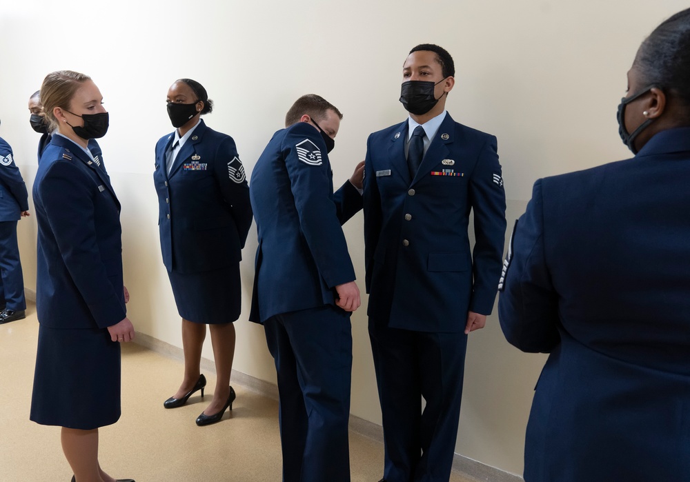 Air Force Mortuary Affairs Operations conducts dress blues inspection of deployed Airmen