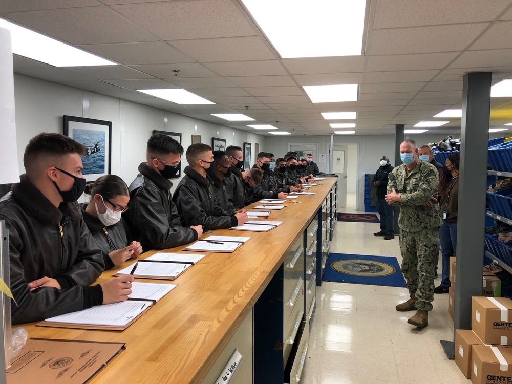 Capt. Jim Strauss, Commanding Officer, Fleet Logistics Center Jacksonville addresses Naval Aircrew students during their initial flight gear issue at NAS Pensacola