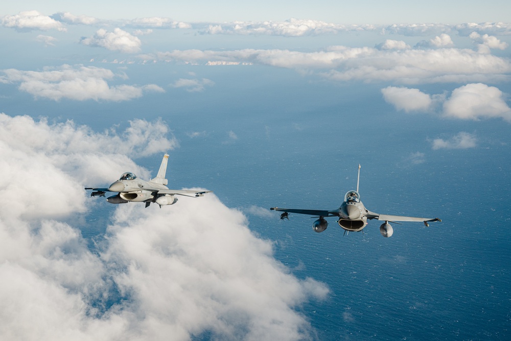 United States F/A-18 Super Hornets and Greek F-16 Fighting Falcons conduct air-to-air training