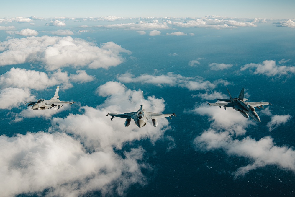 United States F/A-18 Super Hornets and Greek F-16 Fighting Falcons conduct air-to-air training over the Ionian Sea as a part of Neptune Strike 2022