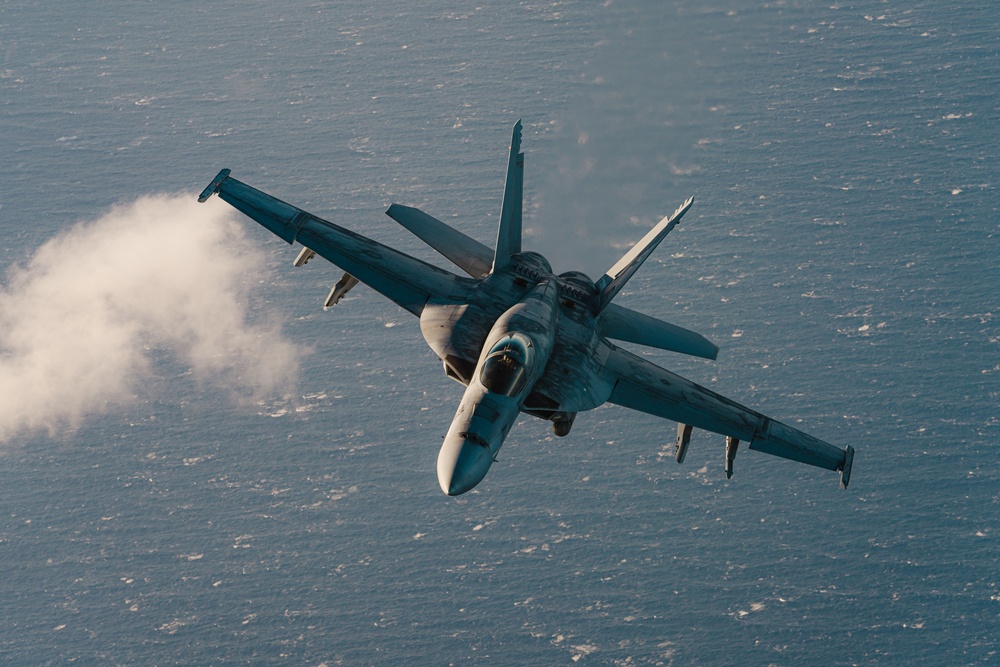 United States F/A-18 Super Hornets and Greek F-16 Fighting Falcons conduct air-to-air training over the Ionian Sea as a part of Neptune Strike 2022