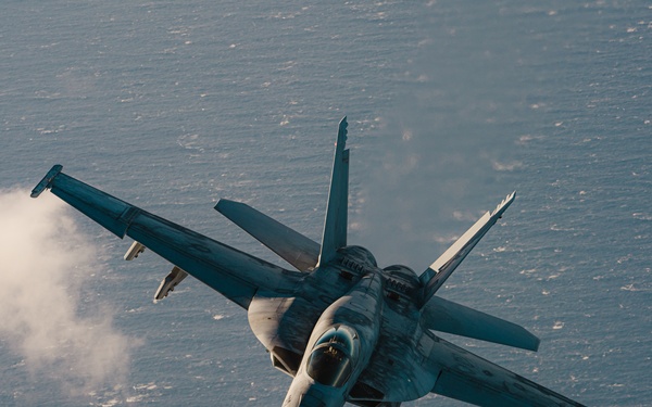 United States F/A-18 Super Hornets and Greek F-16 Fighting Falcons conduct air-to-air training over the Ionian Sea as a part of Neptune Strike 2022