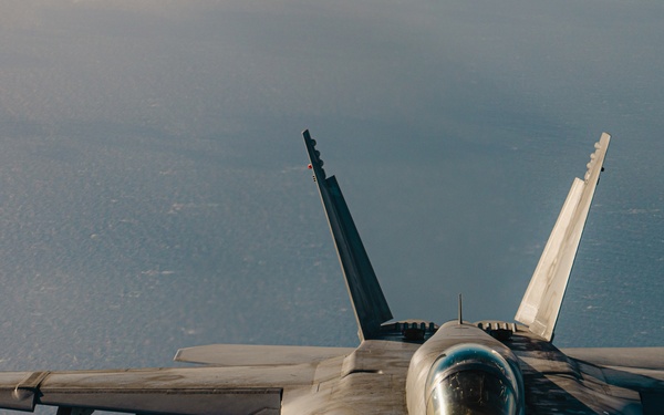 United States F/A-18 Super Hornets and Greek F-16 Fighting Falcons conduct air-to-air training over the Ionian Sea as a part of Neptune Strike 2022