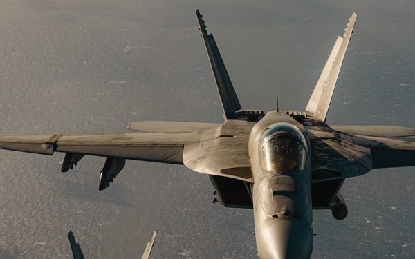 United States F/A-18 Super Hornets and Greek F-16 Fighting Falcons conduct air-to-air training over the Ionian Sea as a part of Neptune Strike 2022