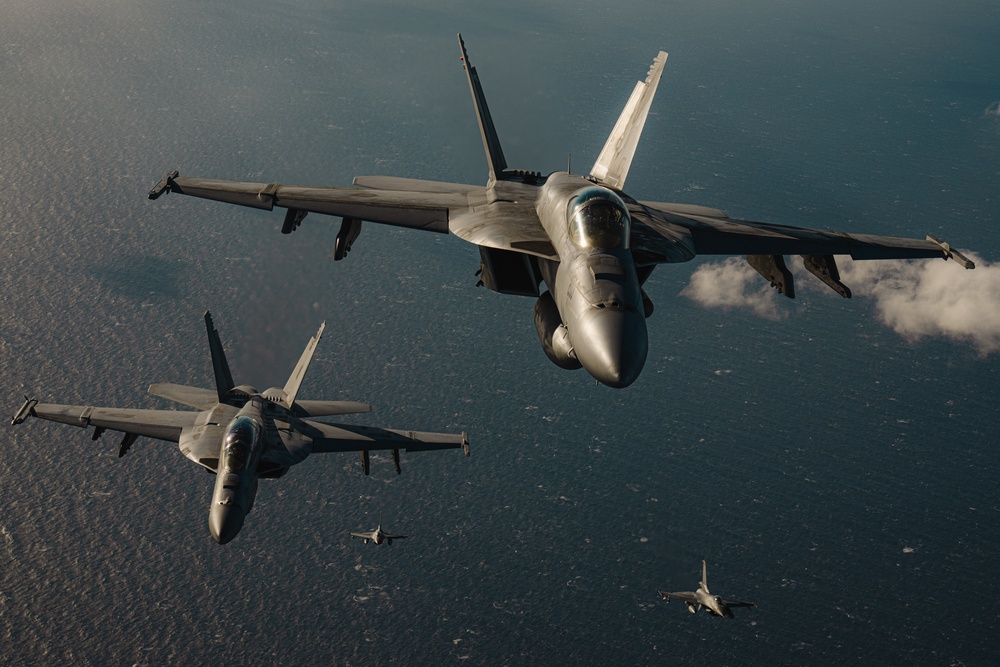 United States F/A-18 Super Hornets and Greek F-16 Fighting Falcons conduct air-to-air training over the Ionian Sea as a part of Neptune Strike 2022