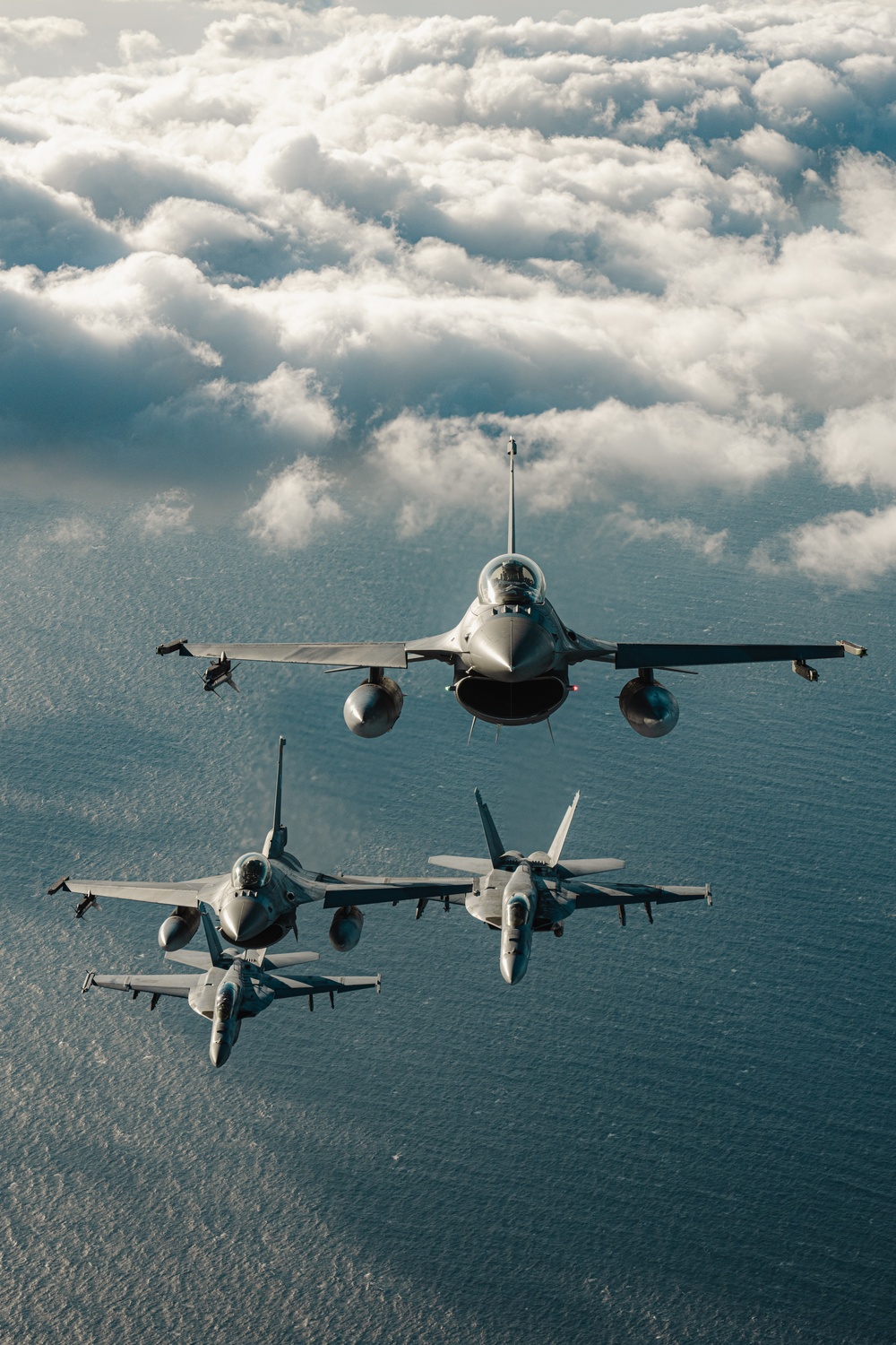 United States F/A-18 Super Hornets and Greek F-16 Fighting Falcons conduct air-to-air training over the Ionian Sea as a part of Neptune Strike 2022