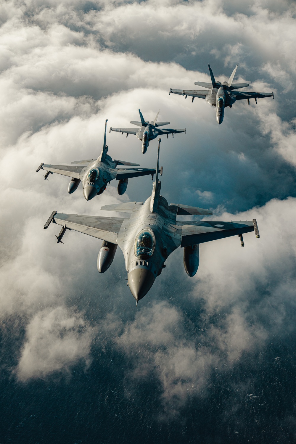 United States F/A-18 Super Hornets and Greek F-16 Fighting Falcons conduct air-to-air training over the Ionian Sea as a part of Neptune Strike 2022