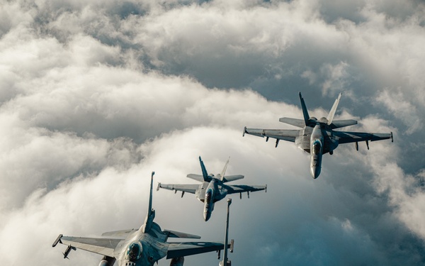 United States F/A-18 Super Hornets and Greek F-16 Fighting Falcons conduct air-to-air training over the Ionian Sea as a part of Neptune Strike 2022