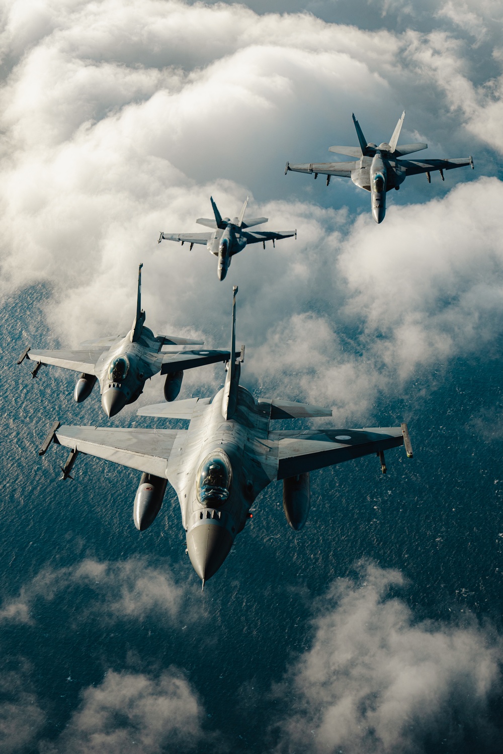 United States F/A-18 Super Hornets and Greek F-16 Fighting Falcons conduct air-to-air training over the Ionian Sea as a part of Neptune Strike 2022