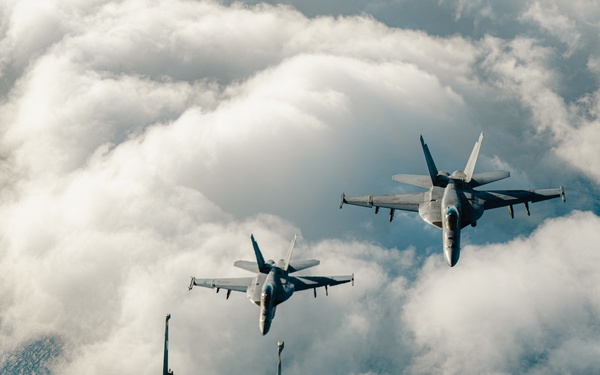 United States F/A-18 Super Hornets and Greek F-16 Fighting Falcons conduct air-to-air training over the Ionian Sea as a part of Neptune Strike 2022