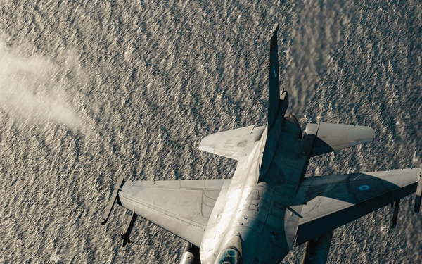 United States F/A-18 Super Hornets and Greek F-16 Fighting Falcons conduct air-to-air training over the Ionian Sea as a part of Neptune Strike 2022