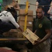 Abraham Lincoln Sailors transport cargo