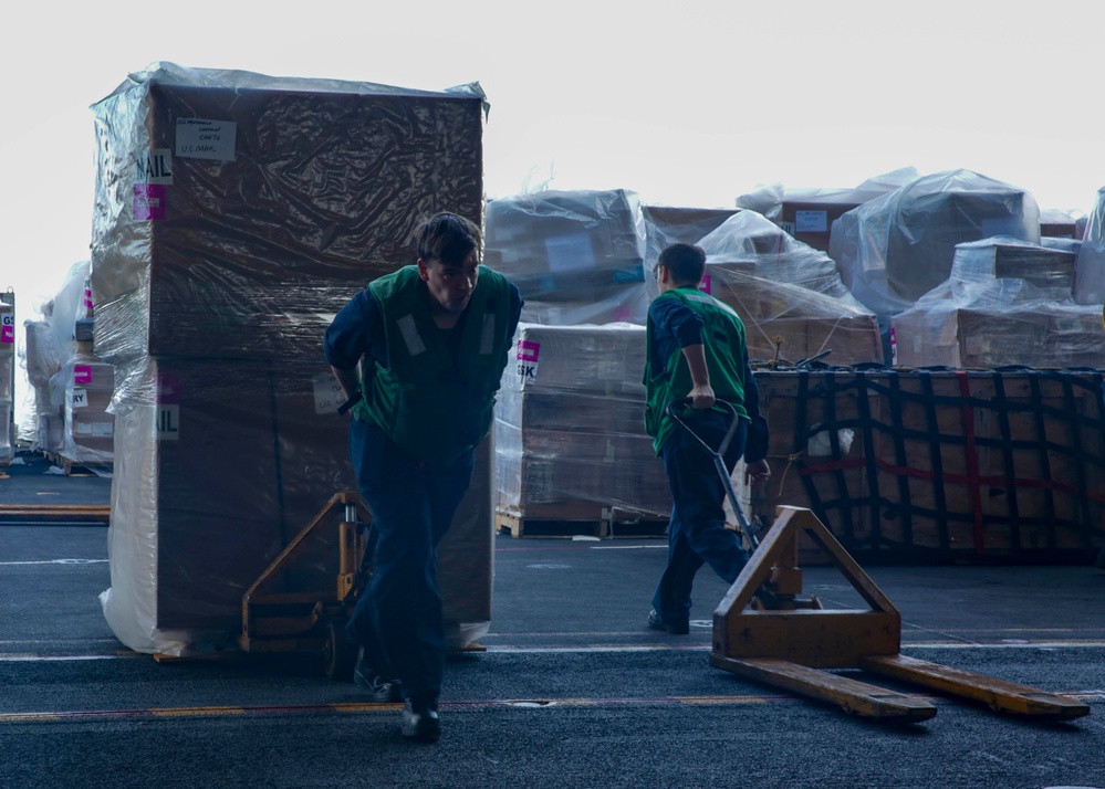 Abraham Lincoln Sailors transport cargo